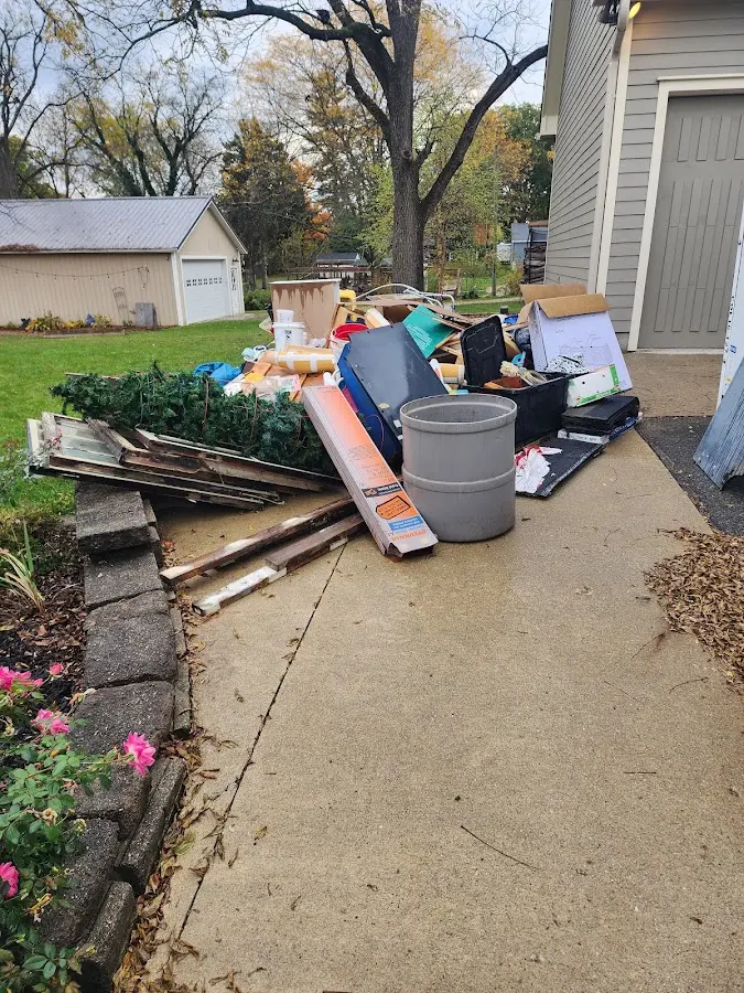 Dumpster being loaded with debris for 30 Yard Dumpster Rental in Ormond Beach